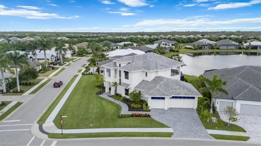 Aerial view of residential area with a large body of water