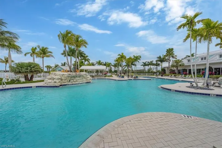 Community pool with a patio