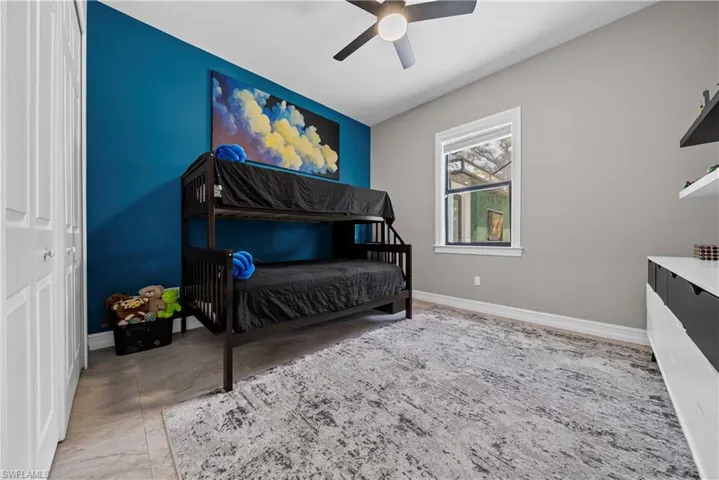 Bedroom with a closet and ceiling fan
