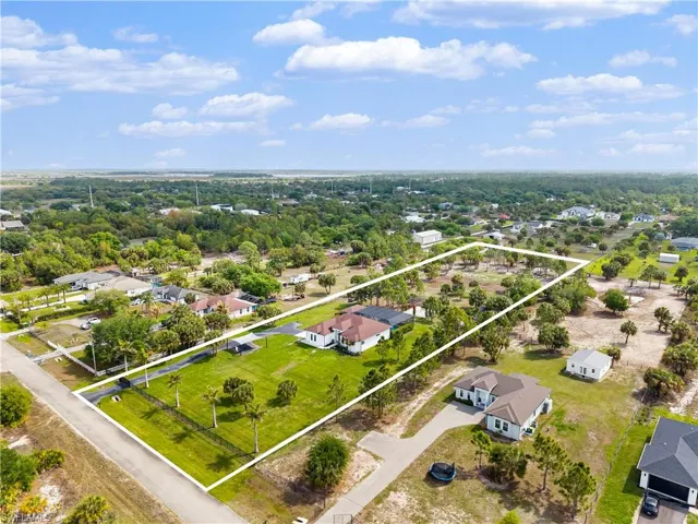 Aerial perspective of suburban area with property boundaries highlighted