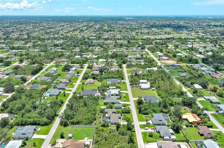 Aerial overview of property's location with nearby suburban area