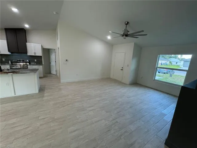 Full master bathroom featuring double vanity, a marble finish shower, and wood finished floors