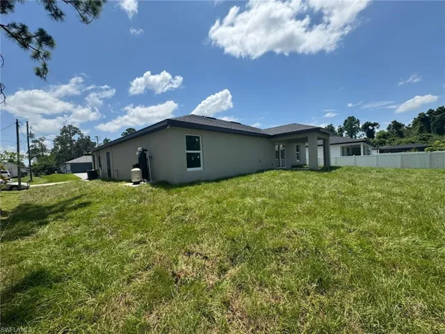 Back of property with stucco siding