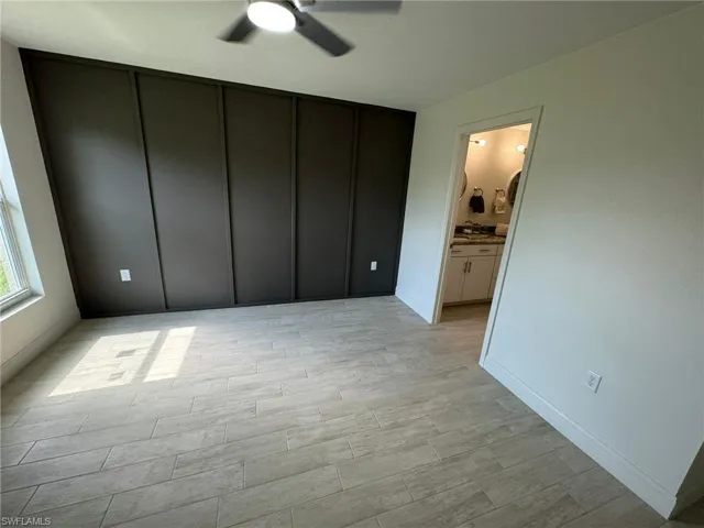Full master bath featuring double vanity and wood finished floors