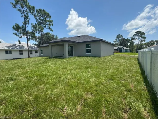 Back of property with stucco siding