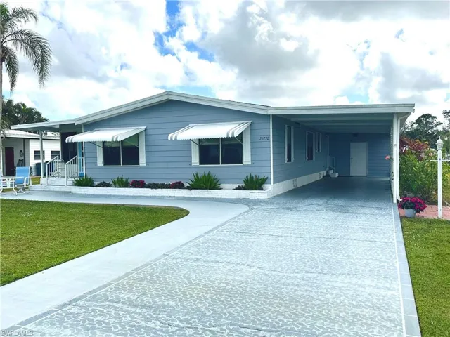 Front of home and painted driveway.