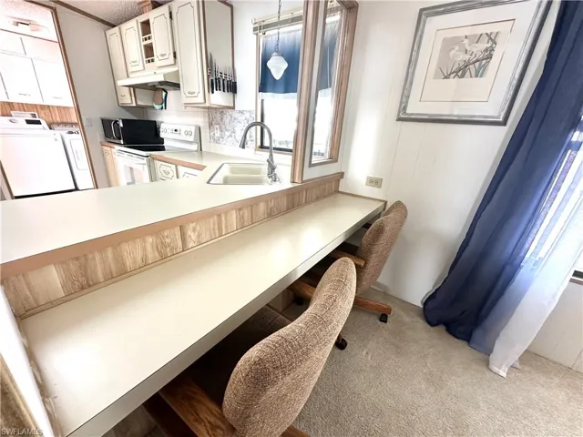 Breakfast Bar, kitchen, and doorway to the laundry room.