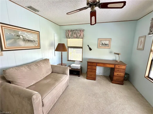 Guest Bedroom featuring a desk and twin sleeper chair.