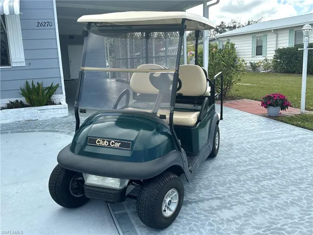 Front of four seat golf cart included in full price sale of home.