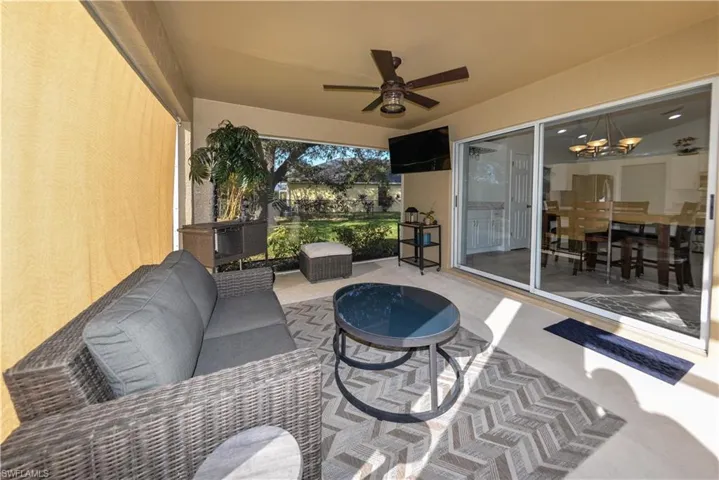 View of patio / terrace with an outdoor living space and ceiling fan
