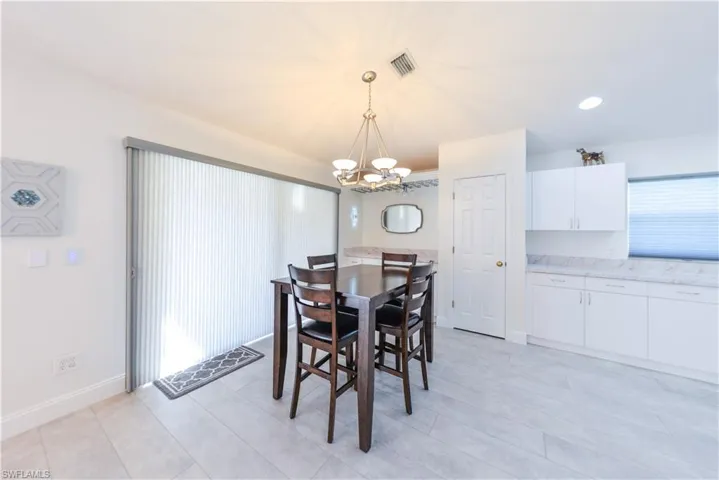Dining space featuring a notable chandelier