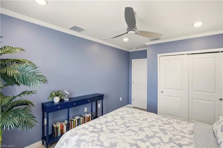 Bedroom featuring ornamental molding, a closet, a ceiling fan, and recessed lighting