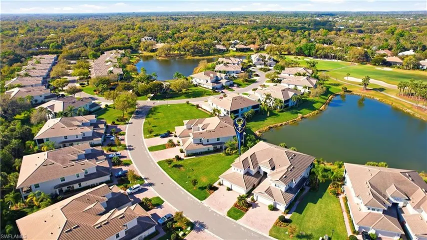 View of property location with a large body of water and nearby suburban area