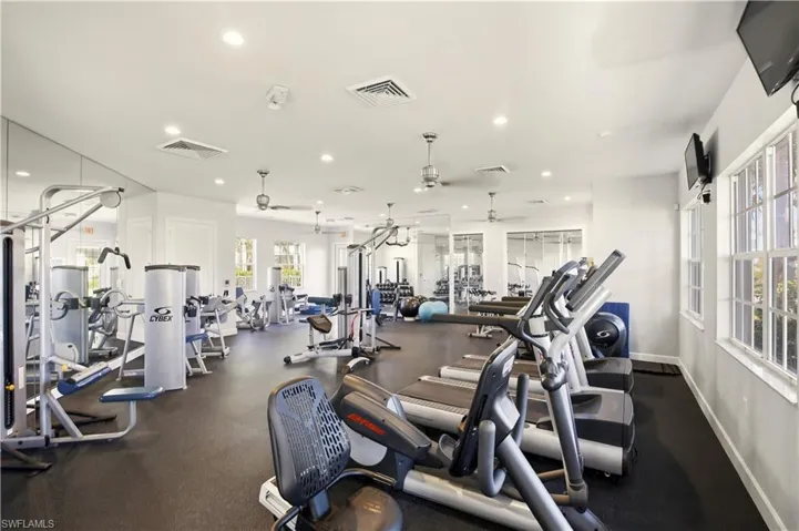 Exercise room with recessed lighting and ceiling fan