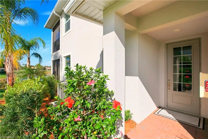 Doorway to property with stucco siding