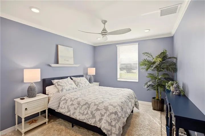 Bedroom featuring ceiling fan, crown molding, and recessed lighting
