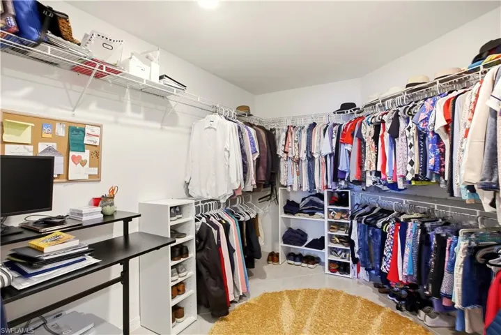 Walk in closet featuring light tile patterned floors