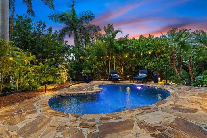 Pool at dusk featuring an outdoor pool and a patio area