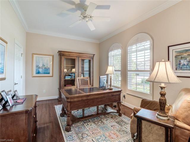 Den with hardwood flooring