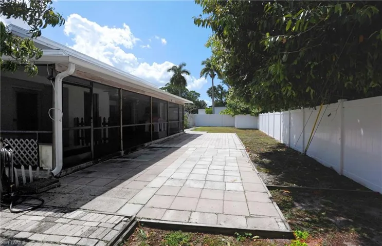 Spacious backyard with extended patio area