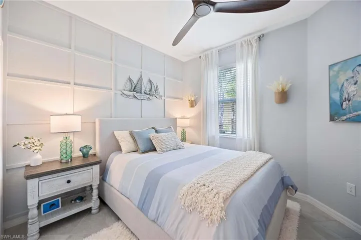 Bedroom with baseboards and ceiling fan