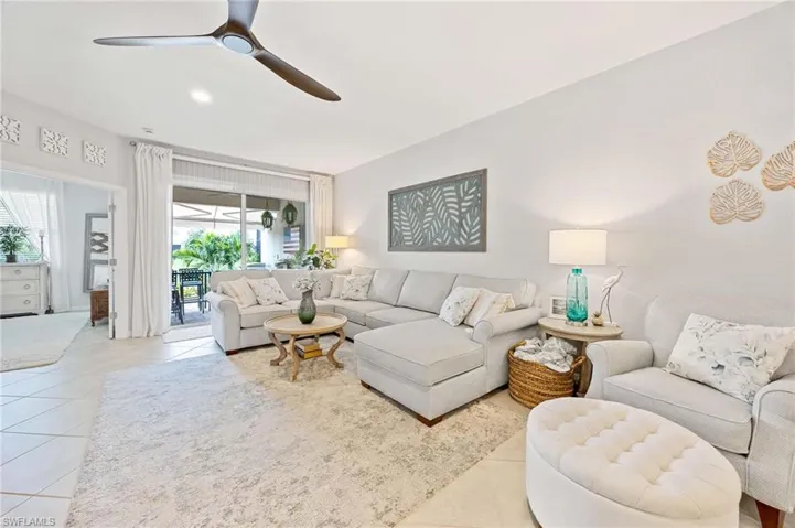 Tiled living area with a ceiling fan