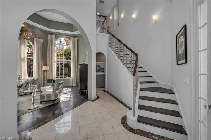 The hardwood floors were added to the stairs, with custom-pained railings and matching wood handrails.