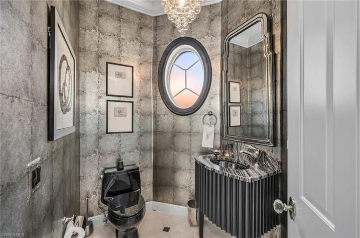 This custom-designed guest powder room welcomes your guests with flair and style.