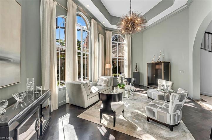 Elegant wood floors in herringbone pattern truly make this room stand out.