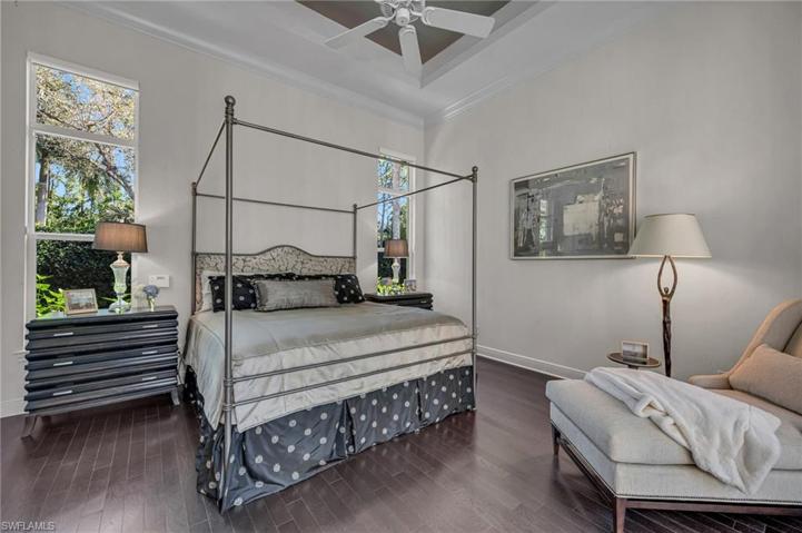 The Primary Suite has 13-foot, lit tray  ceilings and generous moldings, finished off with elegant hardwood floors.