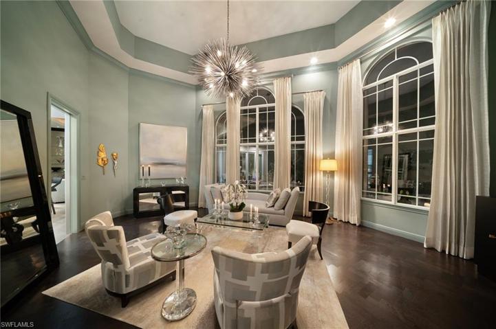 Begin your evening out with cocktails and appetizers in this dramatic living room.
