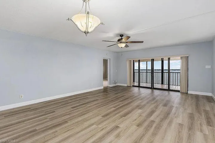 Unfurnished room featuring ceiling fan and light hardwood / wood-style floors