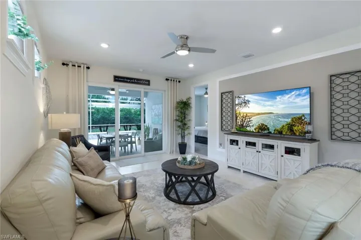 Tiled living room with ceiling fan