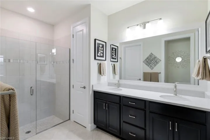 Bathroom with walk in shower and vanity