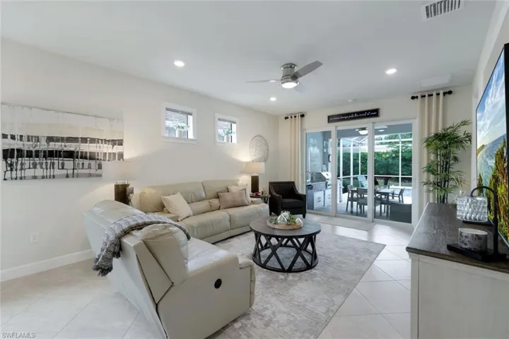 Tiled living room with ceiling fan