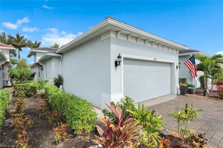 View of property exterior featuring a garage