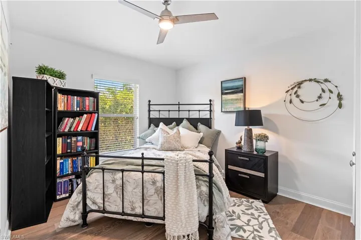 Bedroom featuring wood finished floors and a ceiling fan