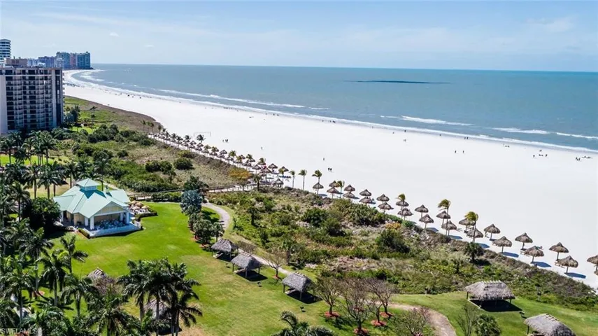 Aerial view of waterfront with a beach