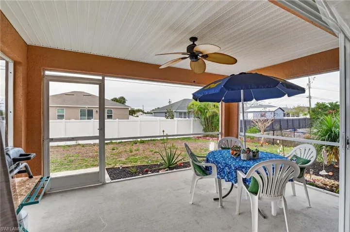 Large sliders open up to screened patio off living area.