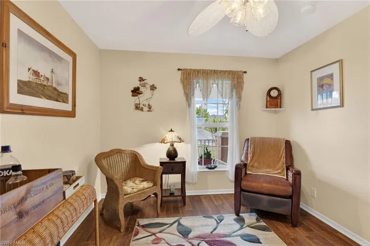 Flex space/den wood-style flooring, window and baseboards