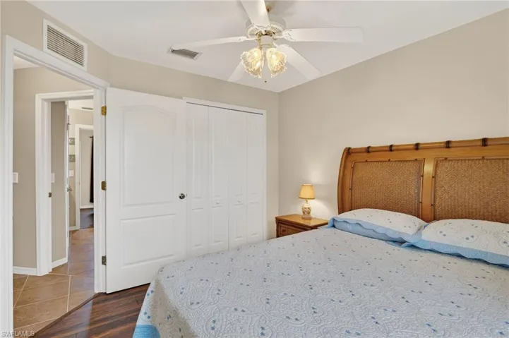 3rd bedroom featuring dark wood-style waterproof flooring, a closet, and a ceiling fan