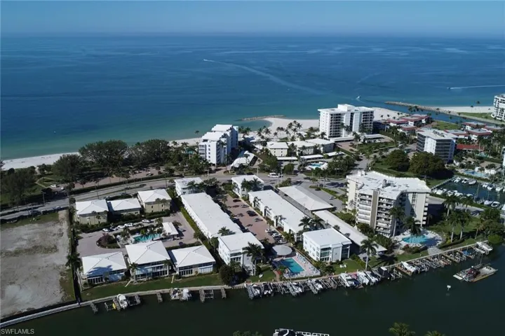 Aerial view of property's location with a large body of water