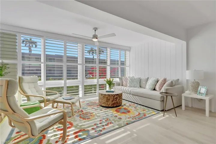 Living room featuring a ceiling fan and wood finished floors