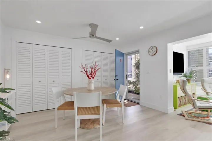 Dining space featuring ceiling fan, light wood finished floors, and recessed lighting
