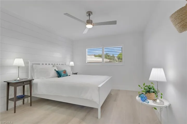 Bedroom featuring light wood finished floors and a ceiling fan