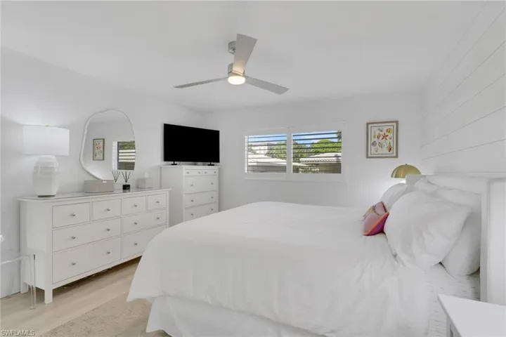 Bedroom featuring light wood-type flooring and a ceiling fan