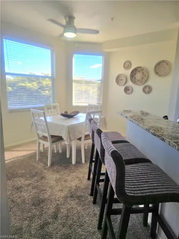 Dining room with bar seating in kitchen