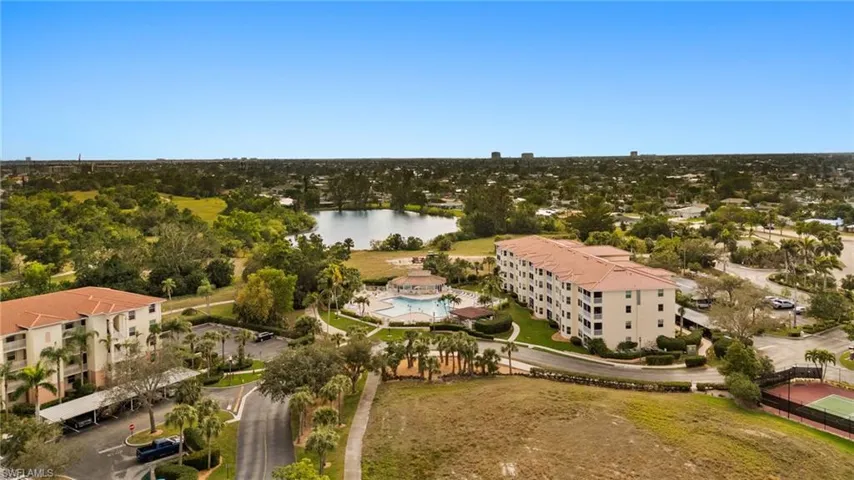 Bird's eye view of surrounding, community pool  and lake