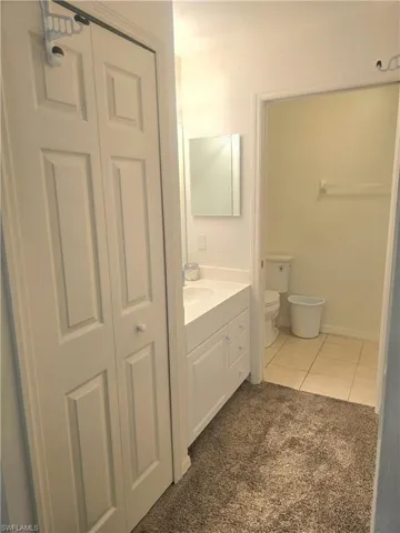 Primary bathroom features walk in shower, private toilet area