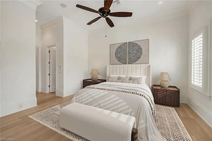 Virtually-staged primary bedroom.